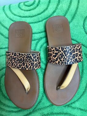 Reef Women's Cushion Sol Sandals , a brown strap with a leopard print pattern.